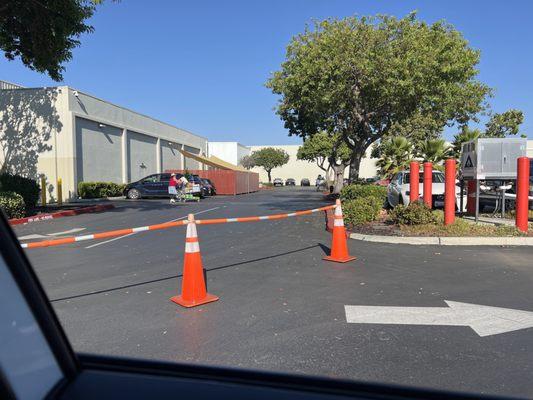 Entrance to the station is complicated and there's a bit of an attempt to make it orderly with these cones.