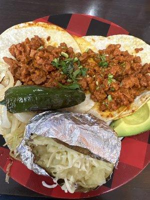 2 Pastor taco, baked potato with Jack cheese, avocado, grilled onions and jalapeño