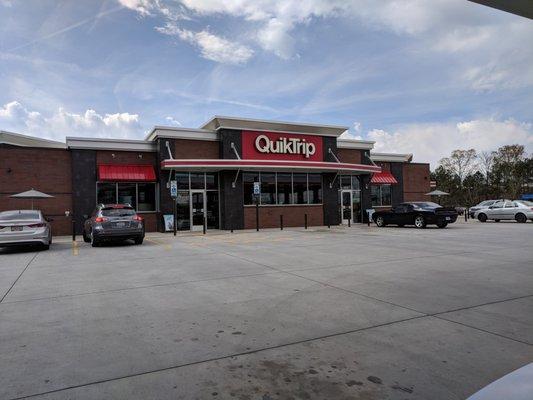 Outside the convenience store. Storefront/entrance.