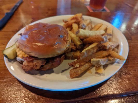 Chicken sandwich and potatoes.