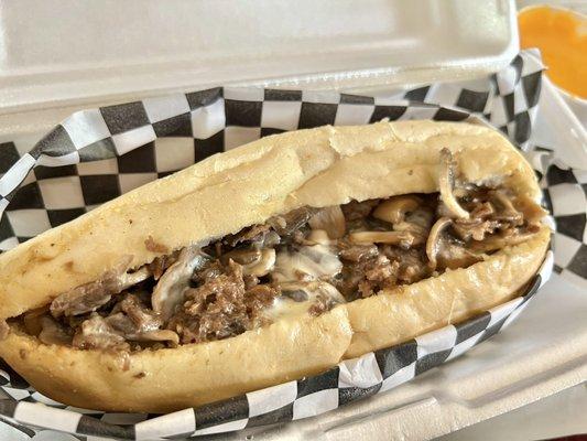 Mushrooms Cheese Steak Philly with a side of whiz in the back