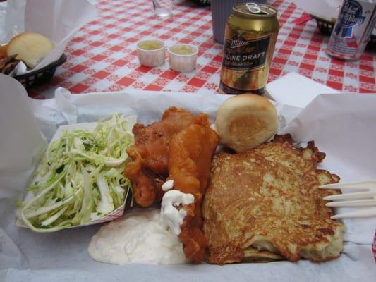 cole slaw, 2 pieces of fish, roll, 2 potato pancakes, and amazing tartar sauce! with Milwaukee style beverage on the side.