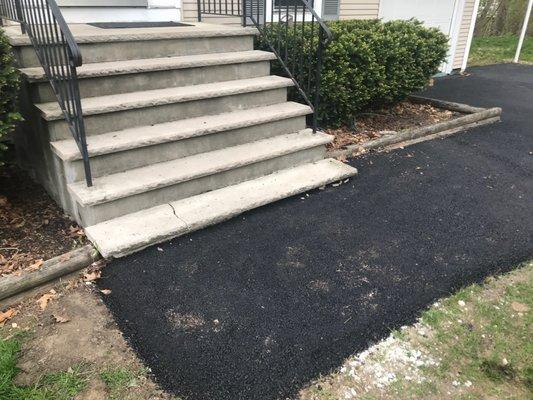 Broken bottom step was whole before the job. Note the pieces of it on top of the new pavement.