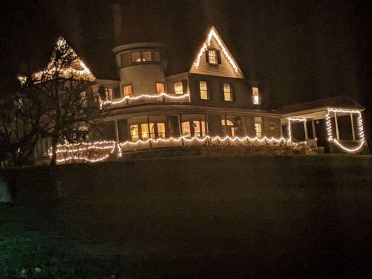 The mansion lit up at night