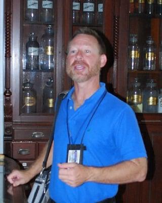 Our tour guide, Bill, telling a story in the Pharmacy Museum.