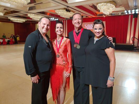 A photo from a Ballroom Competition with a few of our beloved students.