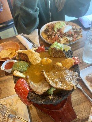 Molcajete and nachos in background. Yum!