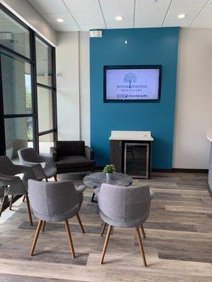 Chic waiting room (water bottles and a Keurig with a variety of coffees and teas available before Corona)