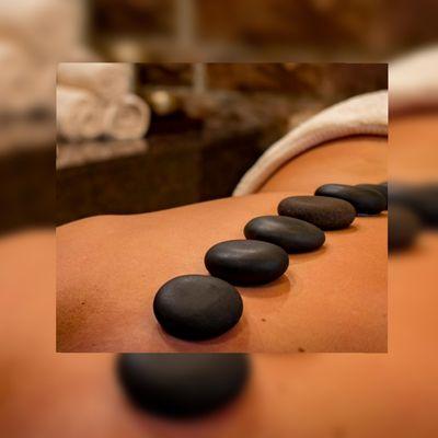 Help relieve tension by using heat during Hot Stone therapy.