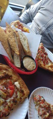 Chicken bacon pizzas and bread sticks