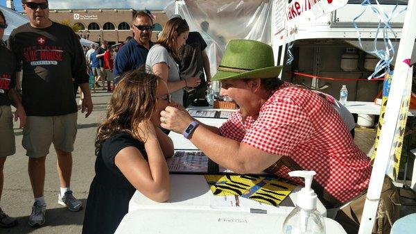 Get your mustache at the cheese challenge tent