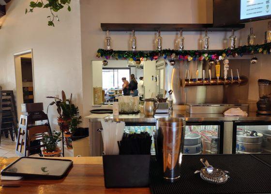 View behind the bar towards the kitchen preparation area