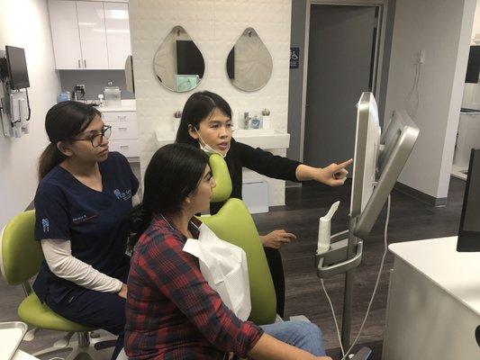 Dr Luong reviewing a patient's Itero scan and discussing her orthodontic options. Invisalign / Braces