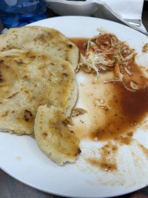 Pupusas (what's left of them) with some curtido (vinegar based slaw) and tomato sauce.