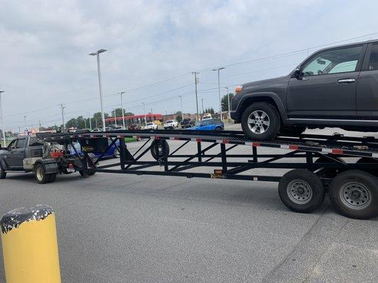 Towing a hot shot truck and trailer.