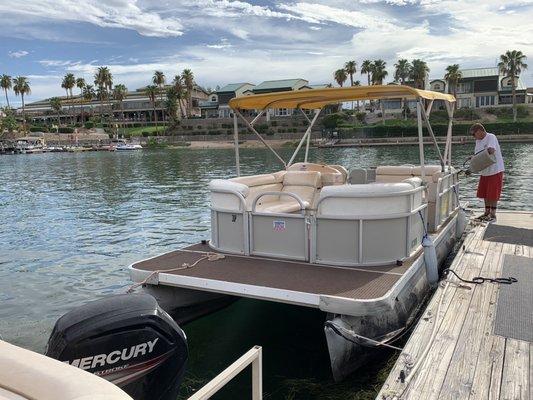 Pontoon boat. Nice ledge to jump off. Very easy to drive!