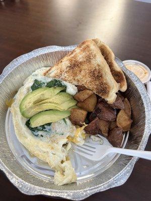 Healthy omelet- egg whites, grilled chicken, spinach, cheddar, avocado & sriracha mayo on the side. Home fries were SO good and super crispy