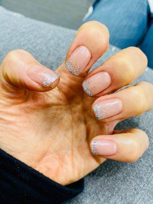 Gel manicure with ombré silver glitter