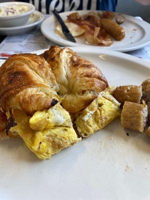 Egg sandwich, cream chipped beef, over easy egg, bacon and sausage