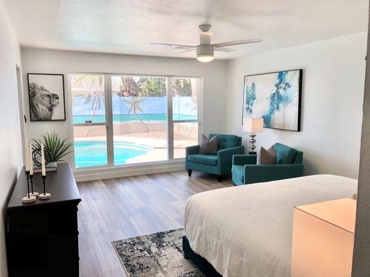 Bedroom with a pool-side view