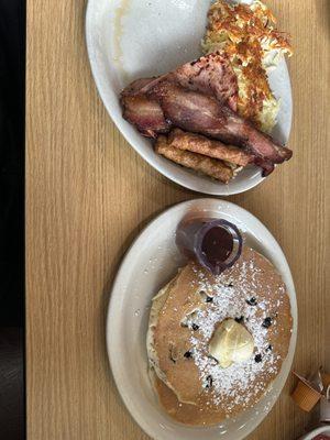 Blueberry pancakes bacon sausage hashbrowns & ham.