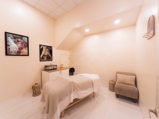 Experience ultimate relaxation in our serene massage room, designed for your comfort and unwind.