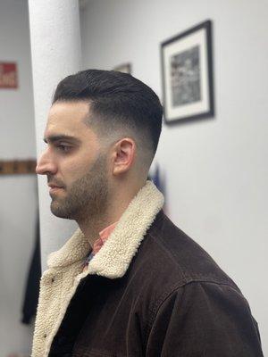 Medium skin fade with beard trim.