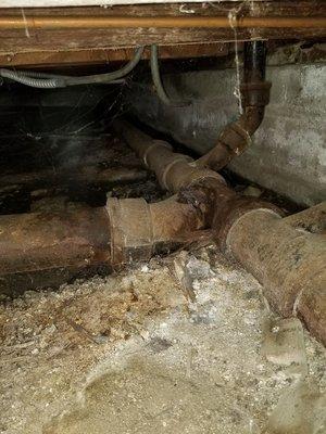 Rotted out cast Iron main sewer line under house (310)743-3915