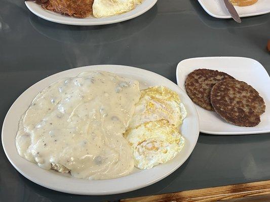 Biscuits and gravy plate, pretty bland gravy! Eggs overcooked.