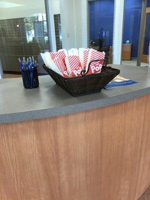 Freshly popped bags of popcorn for customers