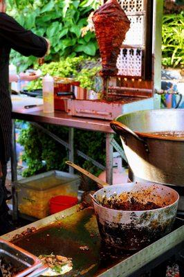 Made-to-Order Tacos and Adobo-Marinated Pork Roasted on a Spit.