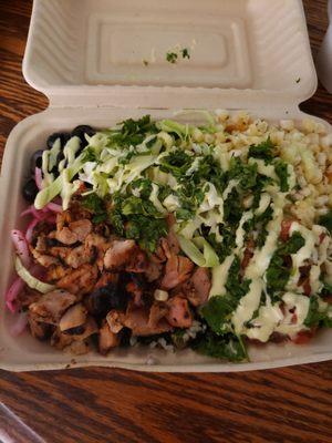 Chicken taco bowl on a bed of romaine lettuce