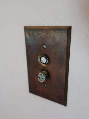 Kinder house, vintage 1907.  Not sure I have encountered such a push button light switch.