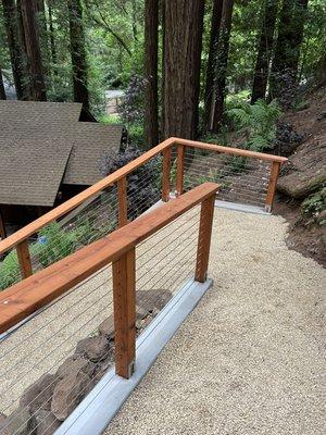 New concrete curb and redwood cable railing. Turned out great!