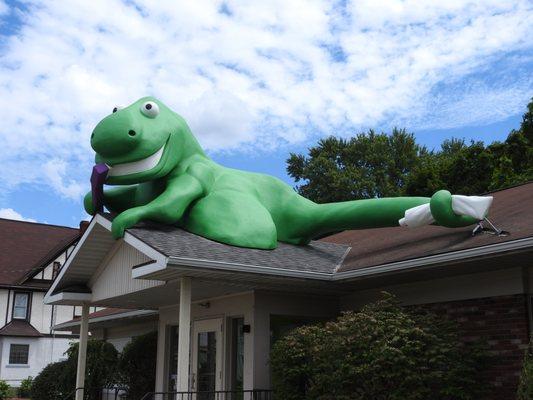 Come visit us under the giant green dinosaur!