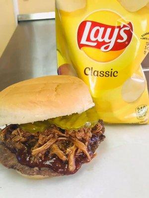 SLAP Burger - Charbroiled Angus Patty topped with pulled pork, pickles, and onion