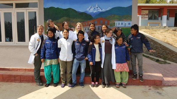 The entire Team: Acupuncture Physicians, Interpreters and Staff enjoying a sunny day at the clinic in Bajrabarahi, Nepal.