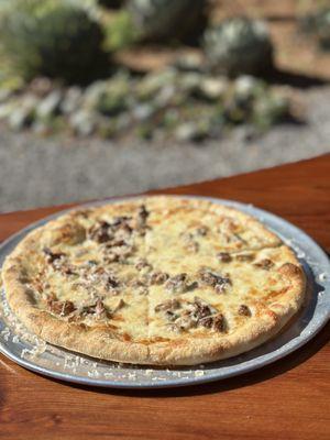 Half and half of porcini + truffle cheese, and wild mushroom pizza