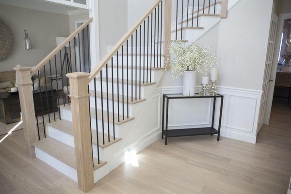 Modern white oak railing upgrade with metal balsuters