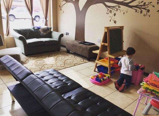 Play area where mommies can sit drink coffee and still see their little ones