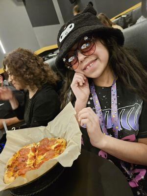 Happy kid with happy hour pizza