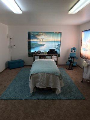 Eiland Massage Studio, massage table, and massage chair.