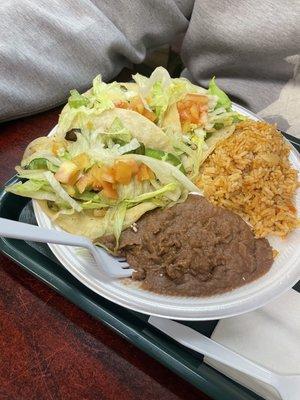 Vegetable plate: Tacos with onions and peppers, lettuce, tomato. Rice. Pintos