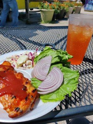 Smoked chicken sandwich with peach habanero sauce, Cole slaw and a refreshing craft soda.