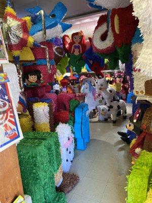 Our back room, full of pinatas.