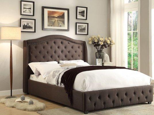 The button-tufted headboard and footboard with nail head accenting available in King, Queen and full