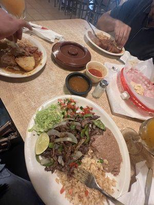 Fajita al carbón (right) Guiso de Rez (left) Guiso de puerco rojo (front)