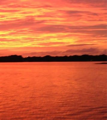 Sunset over Lake Henderson from the dock of the Lakehouse at Inverness Florida.