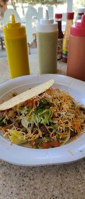 Here's the adada tostada, in the background are tomatillo sauce, guacamole sauce, and spicy red salsa