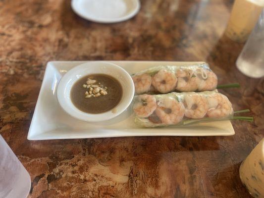 Soft shrimp and pork spring rolls served with peanut sauce